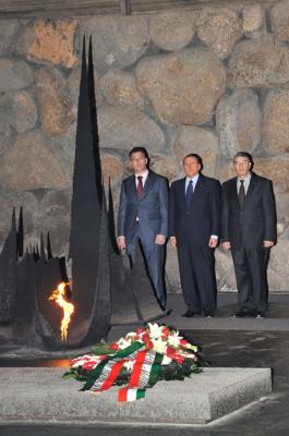 Italian Prime Minister Silvio Berlusconi during a memorial ceremony in the Hall of Remembrance. From the right: Chairman of the Yad Vashem Directorate Avner Shalev, Berlusconi, and Education Minister Gideon Sa’ar