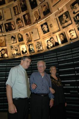 Chairman of the Yad Vashem Directorate Avner Shalev gives Hilda and Simon Glasberg a tour of the Hall of Names at Yad Vashem 
