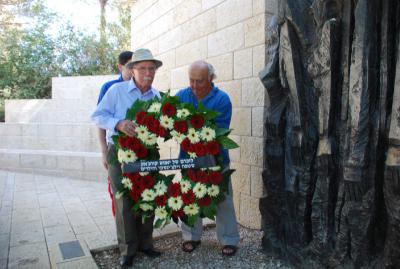 Survivors Yitzhak Skalka (L) and Yitzhak Belfer (R) lay a wreath at  Janusz Korczak Square at Yad Vashem