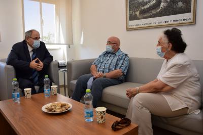 Yad Vashem Chairman Dani Dayan sitting with Holocaust survivors Berthe Badehi and Jacob Weksler