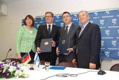 Pictured here are: Chairperson of the Society of Friends of Yad Vashem in Germany Hildegard Muller, German Foreign Minister Guido Westerwelle, Israeli Education Minister Gideon Sa&#039;ar, and Avner Shalev, following the signing of the agreement