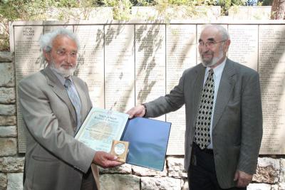 Jacky Offen of the Commission for the Designation of the Righteous presents Olivier de Menthon with the certificate and medal in honor of his grandfather, Henry de Menthon, Yad Vashem, 5 September 2012