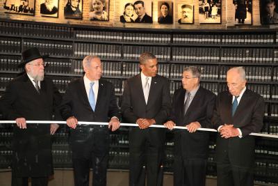 President Barack Obama listens to an explanation in the Hall of Names by Chairman of the Yad Vashem Directorate Mr. Avner Shalev