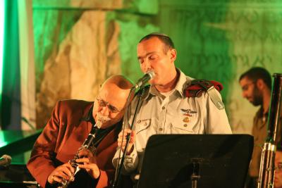 Maestro Giora Feidman plays the clarinet as Lt. Col Shai Abramson,  Chief Cantor of the IDF sings along