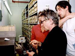 Roman Polanski examines his father&#039;s card from the Mauthausen registry in the Yad Vashem Archives