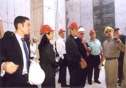Members of the American Society delegation participate in a guided tour of the building site of the New Museum Complex