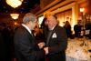 Avner Shalev, Chairman of the Yad Vashem Directorate (left), greets Yad Vashem Pillar Max Glassman (right) at the IHRA dinner