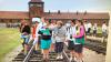 Gita Cycowicz with a group of students touring Auschwitz-Birkenau, c. 2013