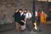 The children of Hein and Martha Snapper rekindle the Eternal Flame in the Hall of Remembrance