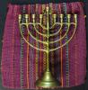 The cloth bag that Lore made as a child, and the Hanukkah menorah that she received from her parents when she was five years old 