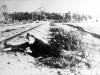 After liberation, partisan Boris Yocha reenacts how he planted dynamite on a railroad track near Vilna to sabotage the Germans.