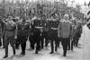 Members of various Nazi organizations march in Regensburg, 10 November 1938. Left: Weingart, county leader. Right: Wenger, head of the local party cell.