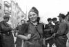 Partisan Rachel Rudnitzki together with other armed partisans in the streets of Vilna during the liberation of the city.