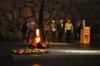 Yad Vashem Legacy Circle Members and Holocaust Survivor Peter Vagi and his wife Dr. Arlene Frank (left) lit the eternal flame, and Holocaust survivor Andrew Burian recited Kaddish during the Memorial Ceremony in Yad Vashem's Hall of Remembrance
