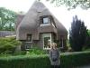 Michal Ben Gera, granddaughter of Abraham van Oosten, near one of the houses designed by her grandfather in Assen