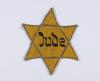 Jewish badge that belonged to Leah Neuhart Gross from the city of Wadowice, Poland. 