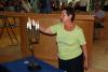 A Holocaust survivor from Greece lighting a candelabra to commemorate the Jews of Rhodes and Kos who were murdered in the Shoah, the Synagogue, Yad Vashem
