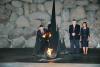 President Kaczynski rekindles the Eternal Flame at the memorial ceremony in the Hall of Remembrance.  Standing behind him are his wife and the Chairman of the Yad Vashem Council Joseph (Tommy) Lapid