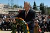 Deputy Prime Minister Ehud Olmert lays a wreath during the ceremony