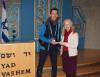 ICEJ USA Outreach Director Michael Hines in the synagogue at Yad Vashem presenting a donation to Dr. Susanna Kokkonen on 14th February, 2017.