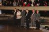 Six Holocaust survivors representing the six million Jews murdered in the Holocaust