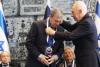President Shimon Peres bestows the award on Avner Shalev during the ceremony