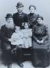 1920's. Standing: Hinda-Feiga (née Falkovich) and Nehemia Burgin. In the middle is their eldest daughter Bluma and another boy. Seated: Feiga or Nehemia's parents – Yehiel Burgin's grandparents