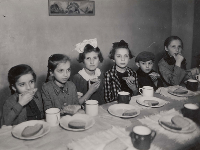 Warsaw, Poland, Girls eating in a Soup Kitchen in the Ghetto