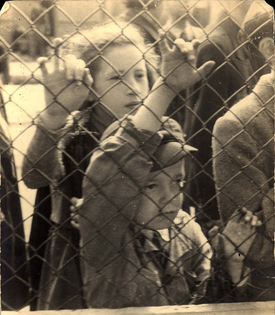 Children behind fence