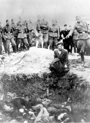 Vinnitsa, Ukraine. A German soldier shoots a Jew above a mass grave, probably 1941
