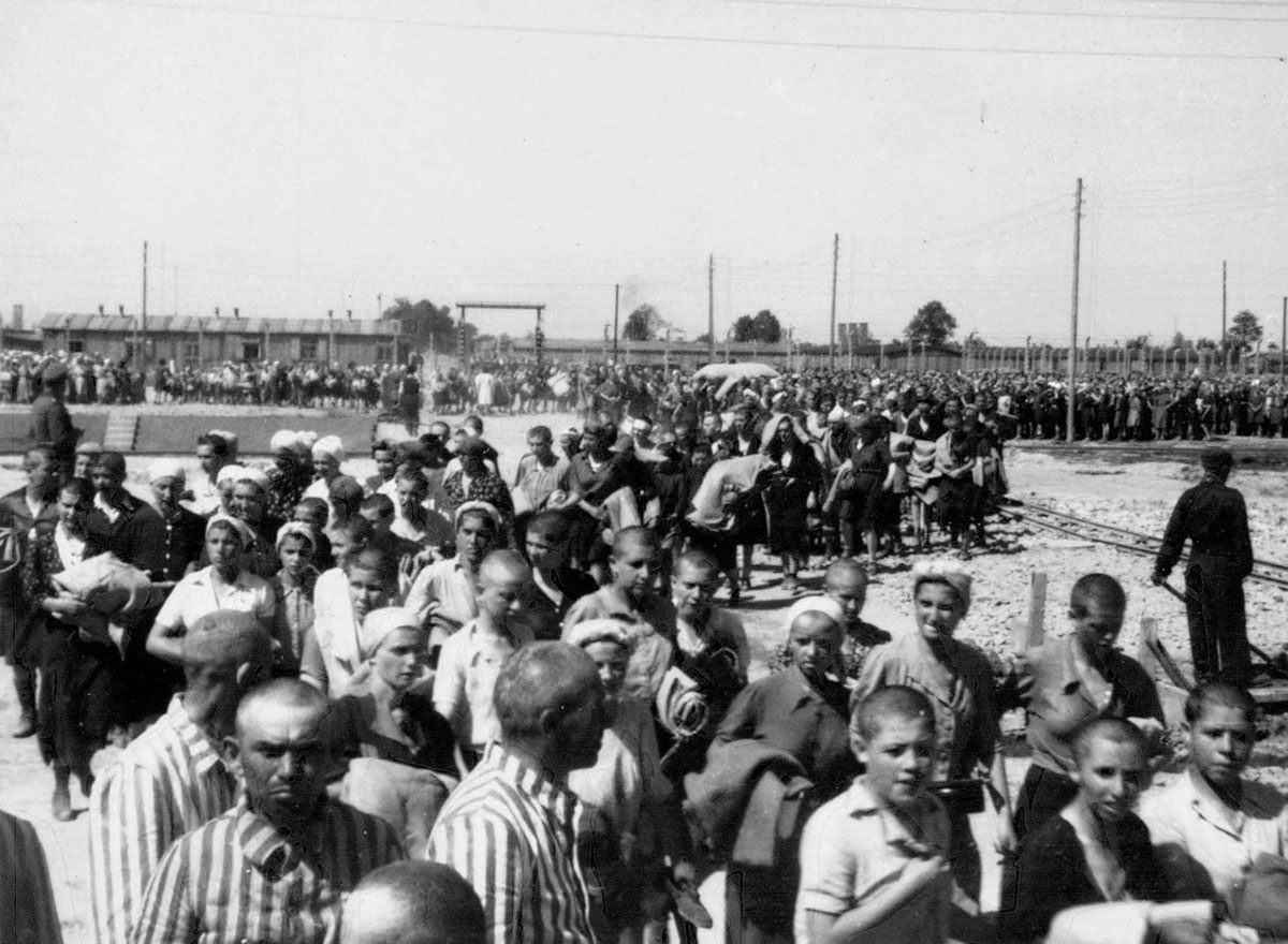 Jewish men and women prisoners on the way to their barracks