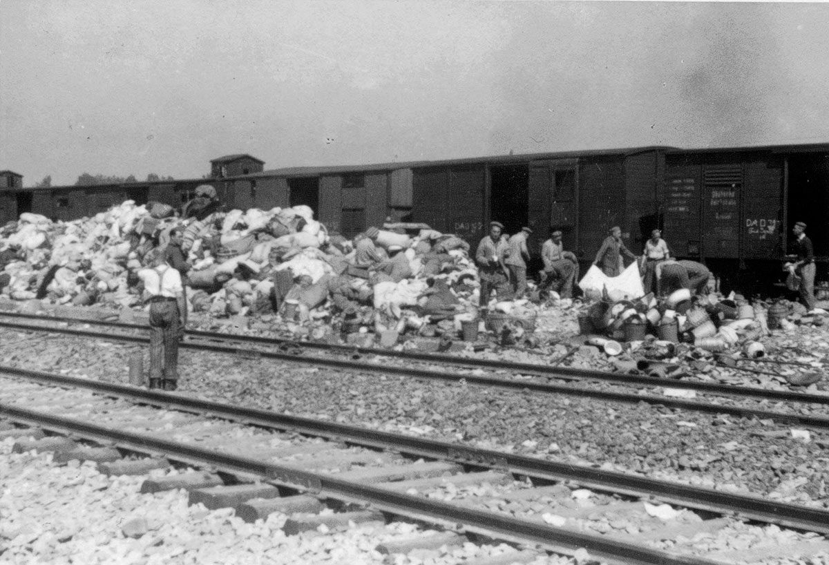 A group of Jewish prisoners works on sorting goods