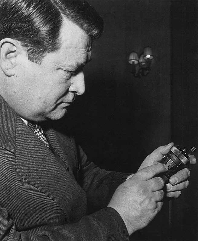 Curt Herzstark holding the "Curta", 1952