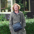 Michal Ben Gera, granddaughter of Abraham van Oosten, near one of the houses designed by her grandfather in Assen