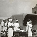 A hospital in the camp in Tehran. In the center is Anna Knobel holding a newborn baby, end of 1942