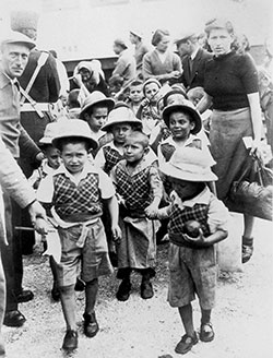 Mandatory Palestine, a group of five-year-old Tehran Children disembarking from a train, 18 February 1943