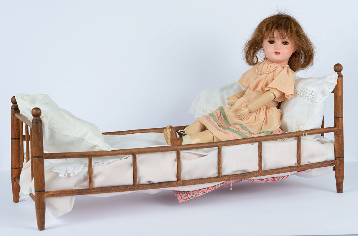 This doll belonged to Claudine Schwartz-Rudel was 7 years old when she fled from Paris to Southern France with her parents