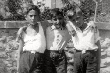 Three friends from the Chabannes children's home outside the local school, the École Saint-Pierre-de-Fursac, 13 September 1941. From left: Joachim Horst Jacob, Erwin Cosmann and Norbert Bikales