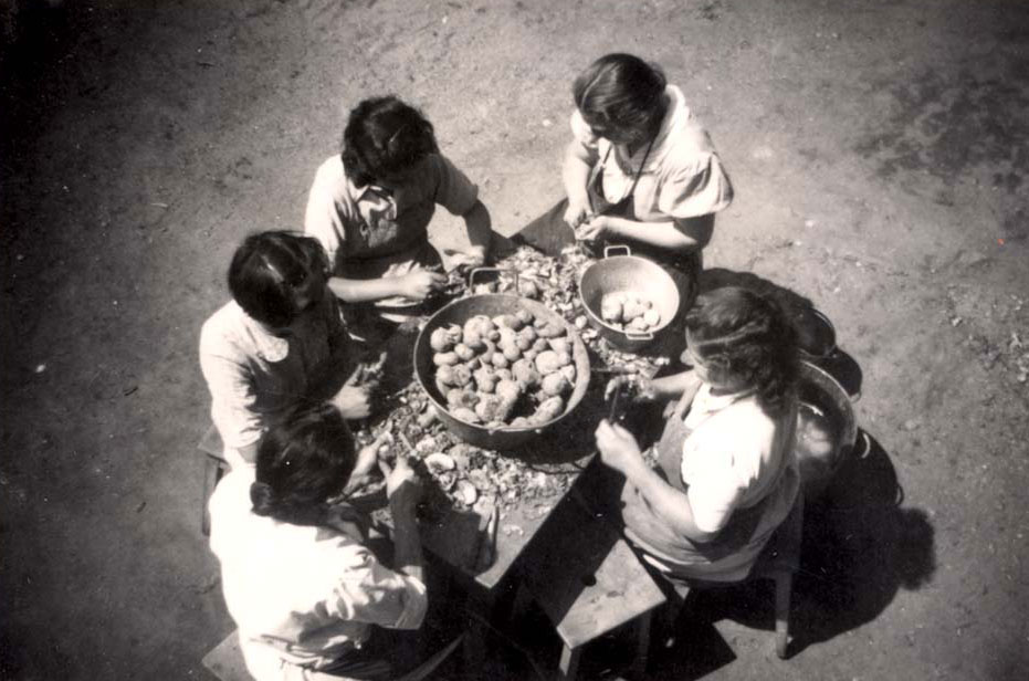 Children at the home in Chamonix helping to peel potatoes, 1943-1944