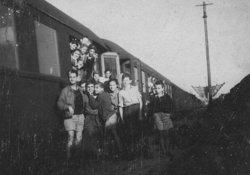 Child Holocaust survivors next to a Red Cross train before their departure from Romania.  Bucharest, September 1947