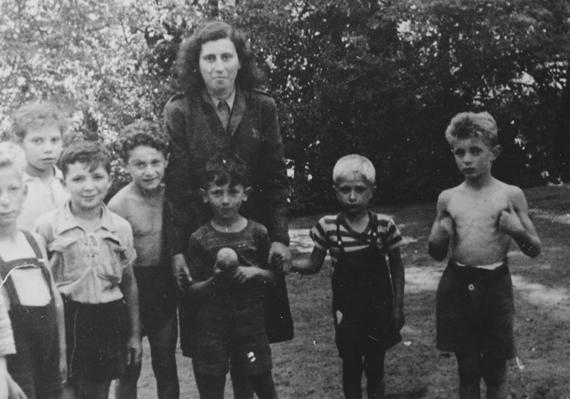 Reuma Schwartz (Weizman) with children from the Gordonia-Maccabi Hatzair Hungary group at the children's home in Blankenese, Hamburg, Germany 1947-8
