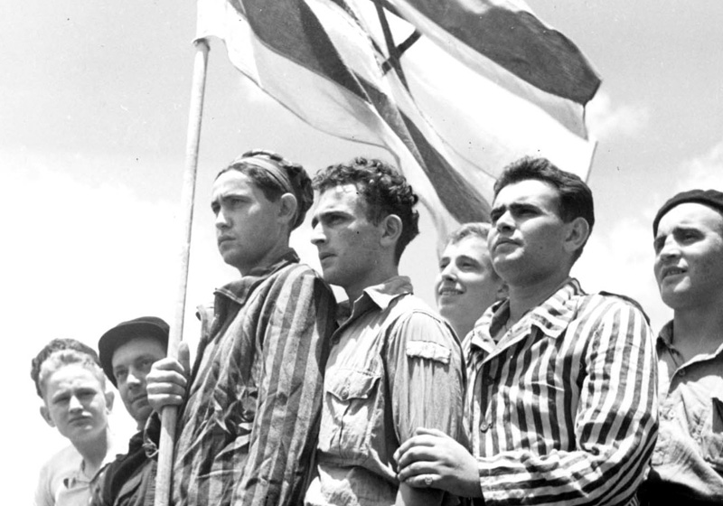 "Buchenwald boys" on the deck of the "Mataroa" on their arrival at Haifa port, Eretz Israel (Mandatory Palestine), 15 July 1945