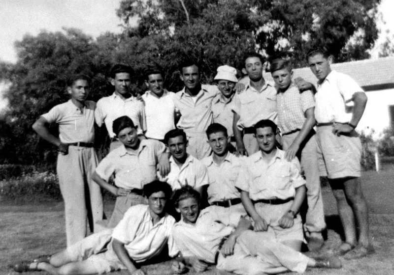 Group of "Buchenwald boys" following their immigration to Eretz Israel (Mandatory Palestine) at the agricultural school in Magdiel, summer 1945
