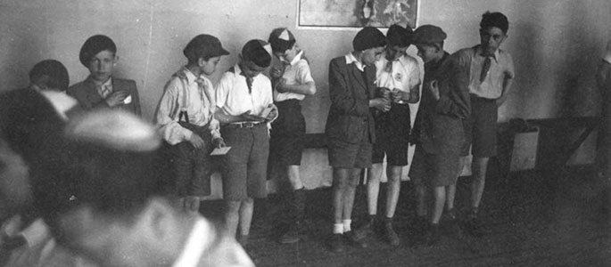 Child survivors during their daytime activity in the Bnei Akiva dormitories. 
Bratislava, 1946