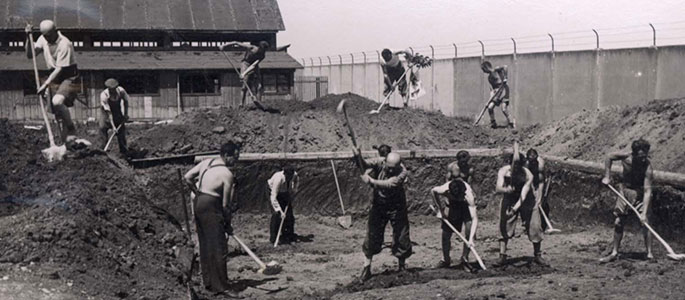 Construction work on the swimming pool in the Nováky forced labor camp for Jews, Slovakia, and camp prisoners spending their free time at the pool