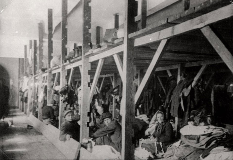 Jews on stools in the “Monopol” tobacco factory storerooms, Skopje, March 1943
