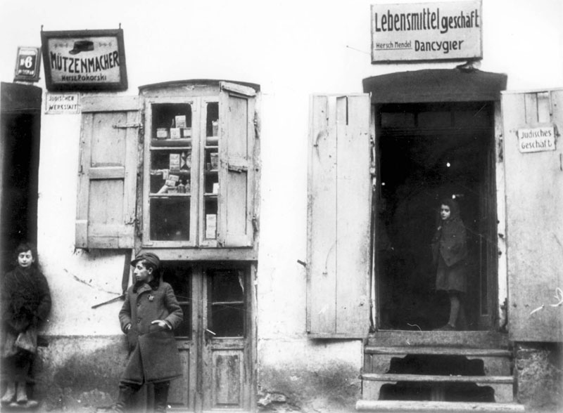 Plonsk , 1940. Businesses with signs declaring that they are owned by Jews