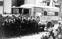 Würzburg on "Boycott Day", 1 April 1933. SS and SA militiamen next to a truck bearing banners calling to boycott Jewish businesses. One of the banners reads "The Jews are our Disaster" (Die Juden sind unser Unglück).