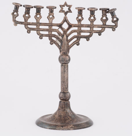 This is one of many Hanukkah menorahs that was plundered by the Nazis. The menorahs, along with other Judaica, was collected by the Jewish Cultural Reconstruction Organization after the war