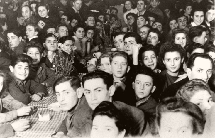 Landsberg, Germany, 1945, First Hanukkah celebration for Nocham (United Pioneer Youth). Among the participants: Etka Litman-Mordkovitz, Marila Friend , Kova Novomiest, Yaakov Levkovitz, Aryeh Levkovitz, Misha Yalon, Senk Mordkovitz, Aryeh Altman, Rutka Altman, Heltzia Noiberg